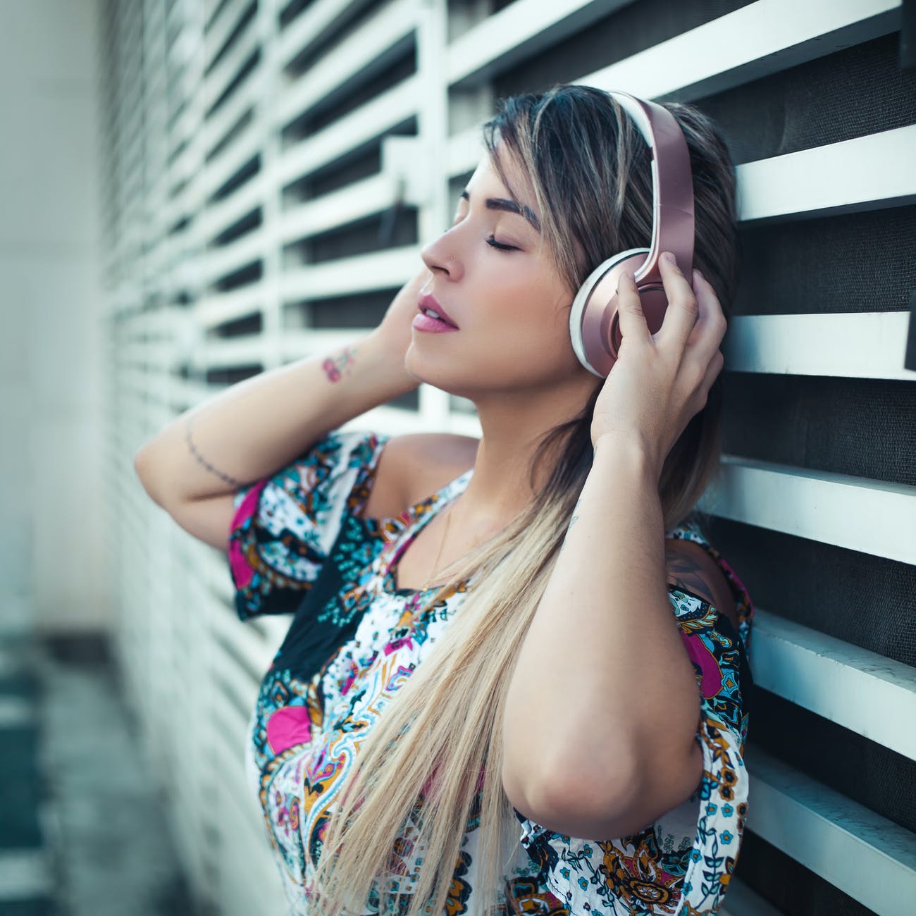 photo of woman using headphones