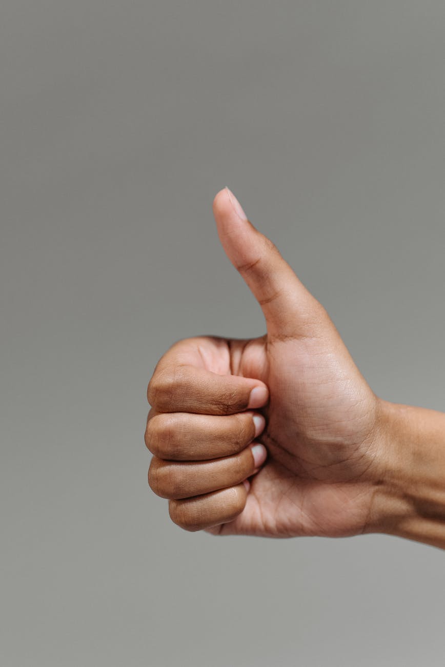 a person doing a thumbs up