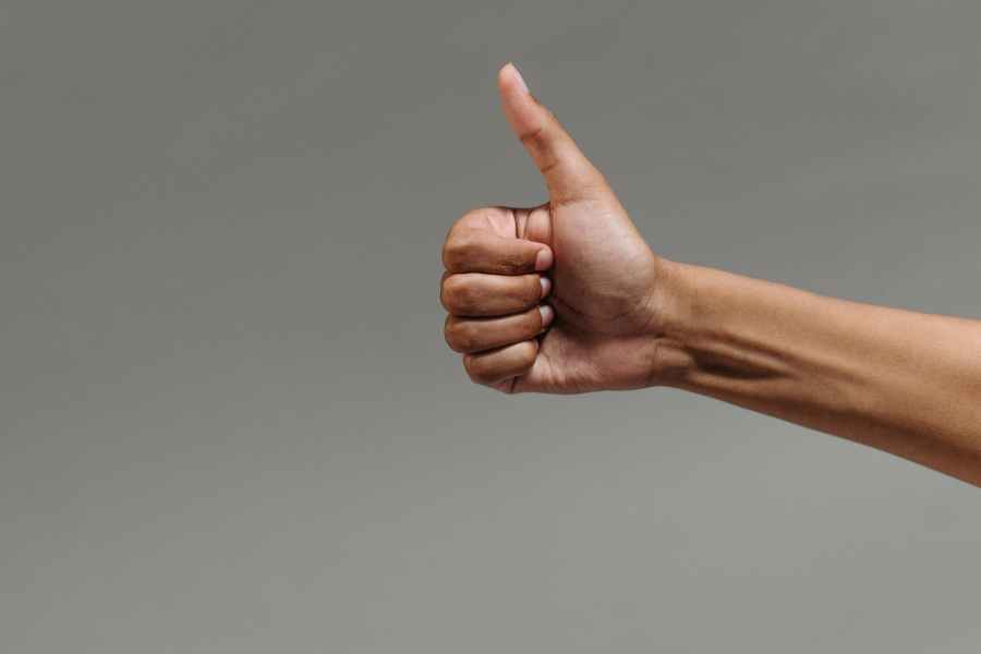 a person doing a thumbs up